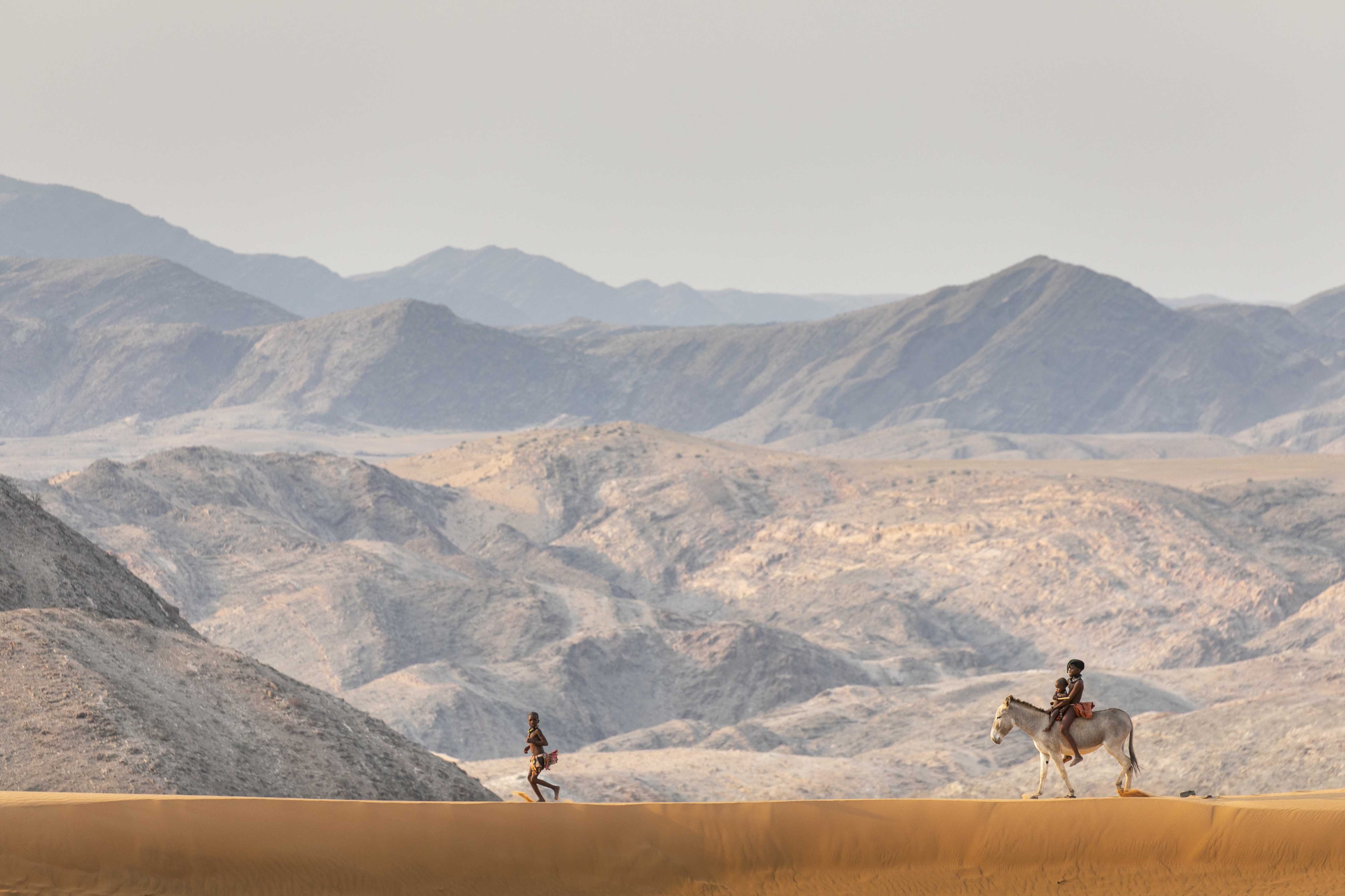 Cultural safari experience connecting with local communities in Africa like the Himba in Namibia